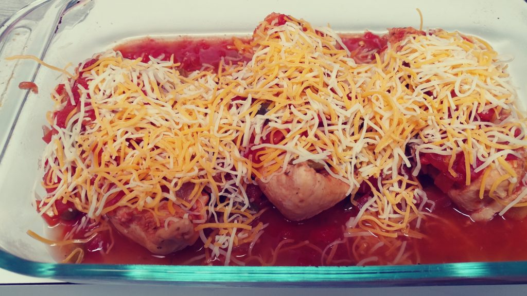Remove the chicken and salsa from the crock pot, cover with cheese, and bake until the cheese is melted.
