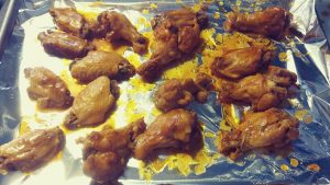 Place the wings on a baking sheet and baste them. cook for 5 minutes on each side at a temp of 425. 