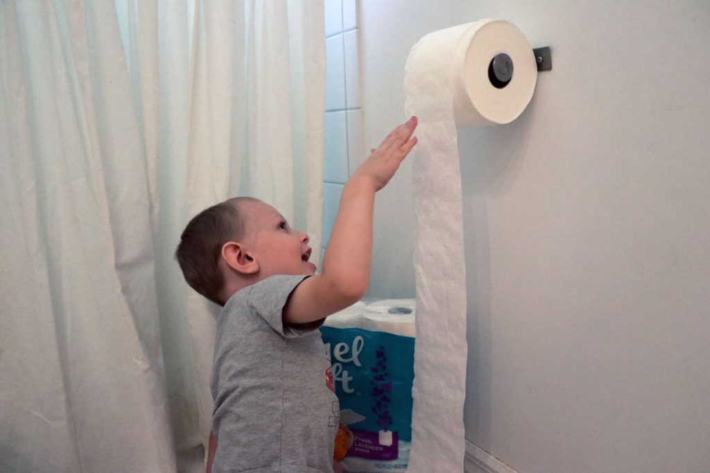 unrolling toilet paper