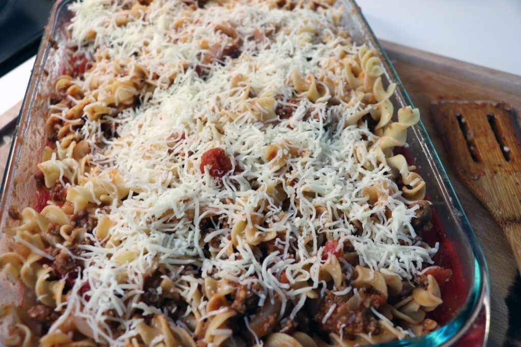 italian pasta bake with shredded cheese and egg noodles 