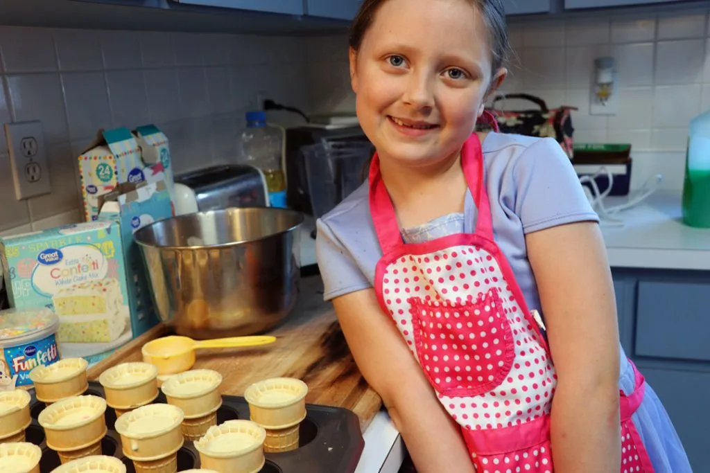 birthday girl makes cupcakes