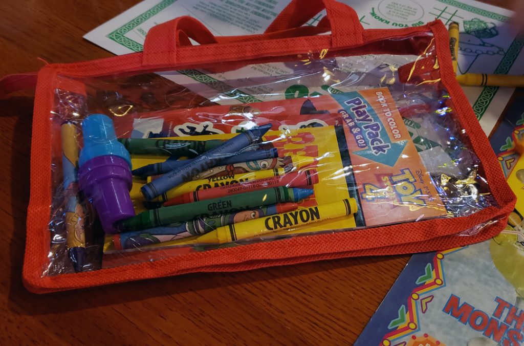 kids' busy bag with crayons and activities for a restaurant 