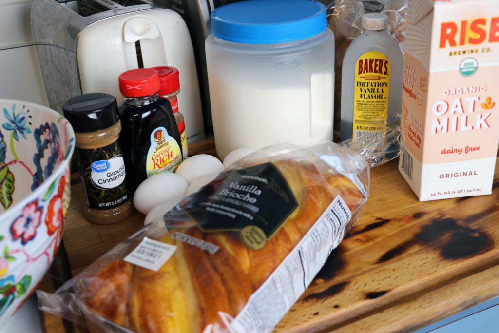 French toast ingredients. Vanilla brioche bread, cinnamon, eggs, oat milk, vanilla extract, sugar