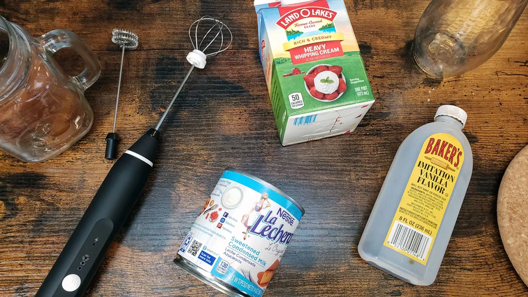 ingredients for sweet cold foam, vanilla, heavy cream and sweetened condensed milk 