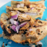 Fried Chicken Tacos with red onions and corn tortillas