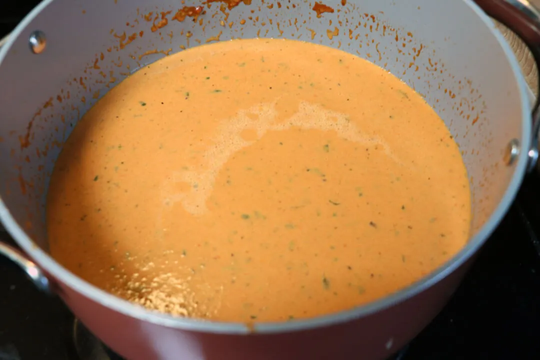 cream of tomato basil soup ready to eat in a Dutch oven