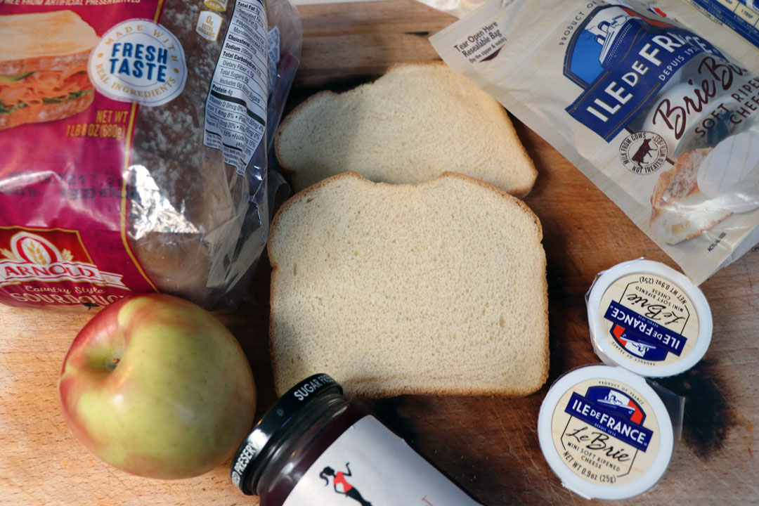 ingredients for a brie, raspberry, and apple grilled cheese.