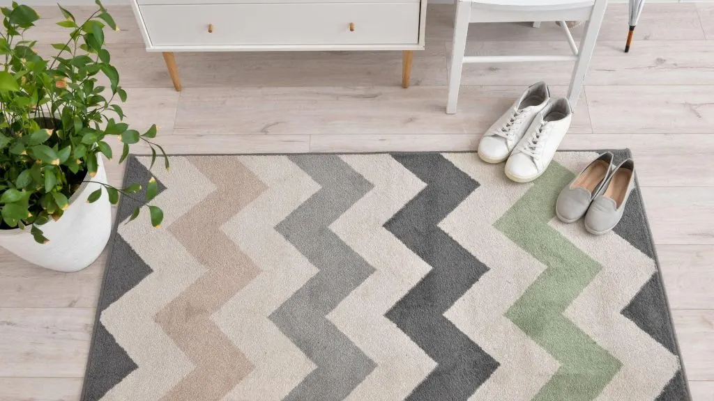 Add a new rug to bring warmth into the room