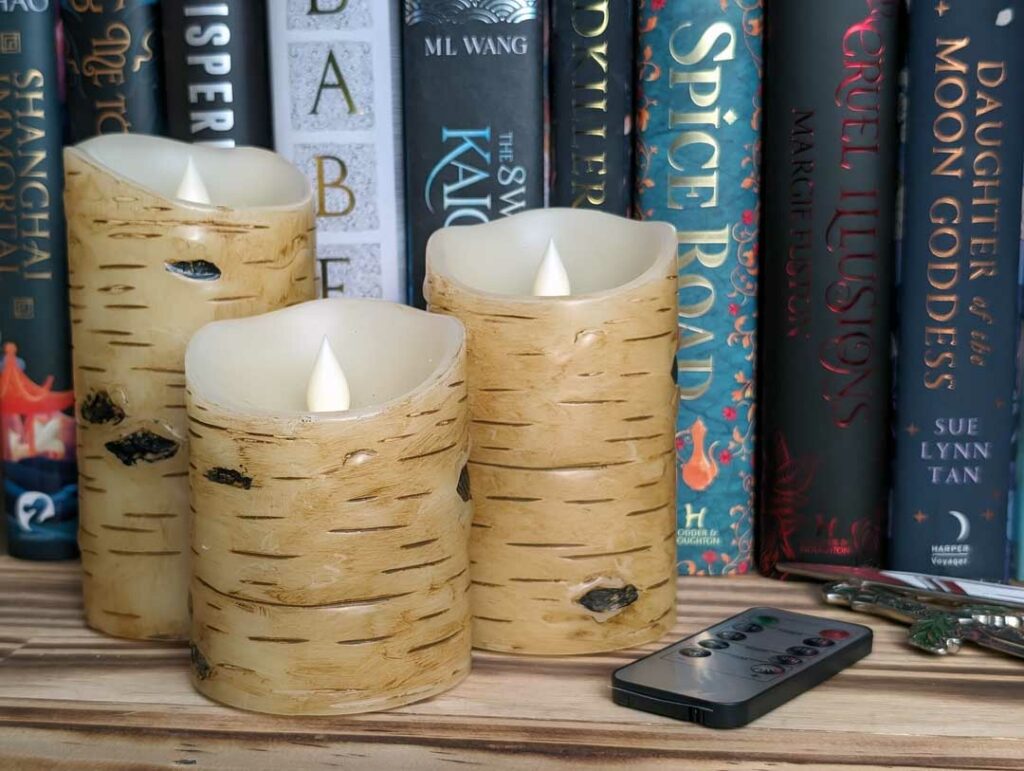 Flameless Candles in front of a bookshelf
