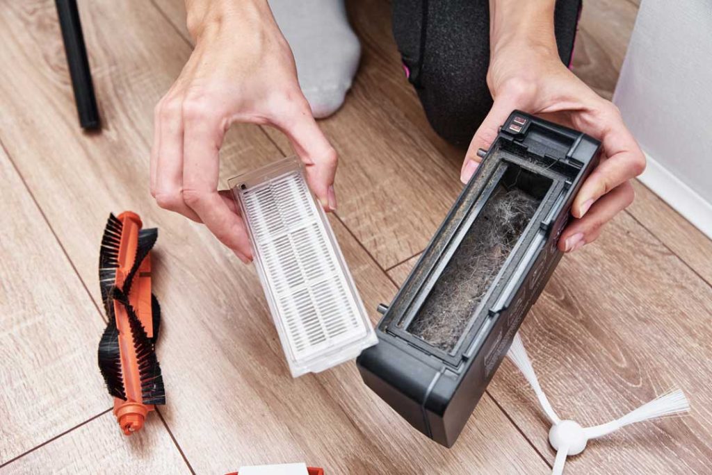 Handheld vacuum cleaning kitchen messes for quick maintenance