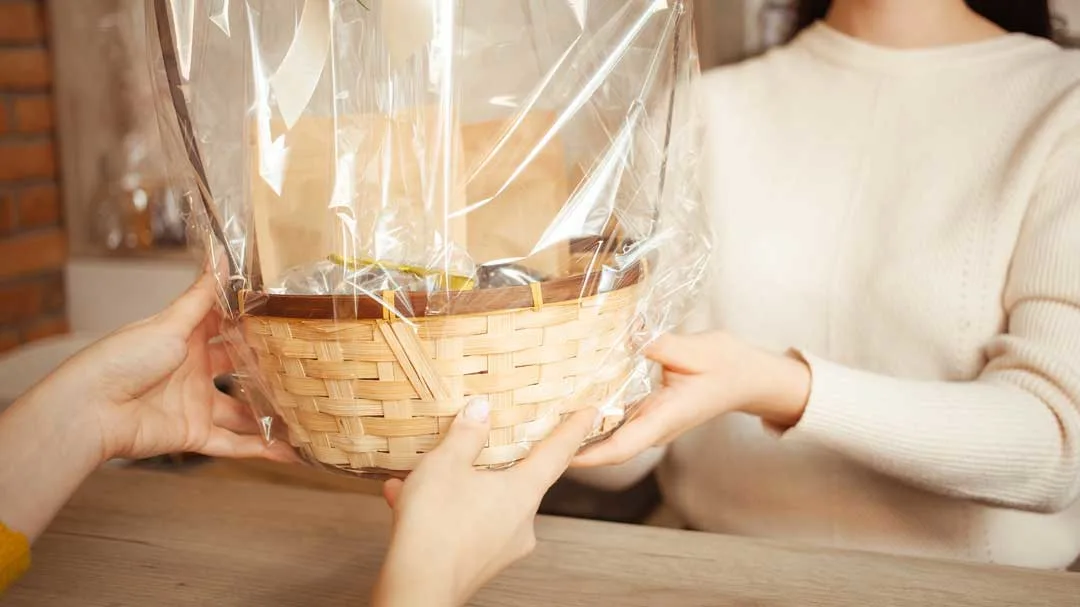 Person holding a thoughtful gift basket