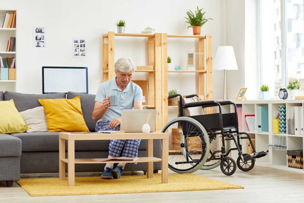 Caregiver creating accessible layout in senior's living room