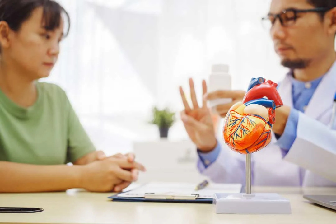 Doctor explaining heart health to patient during a consultation