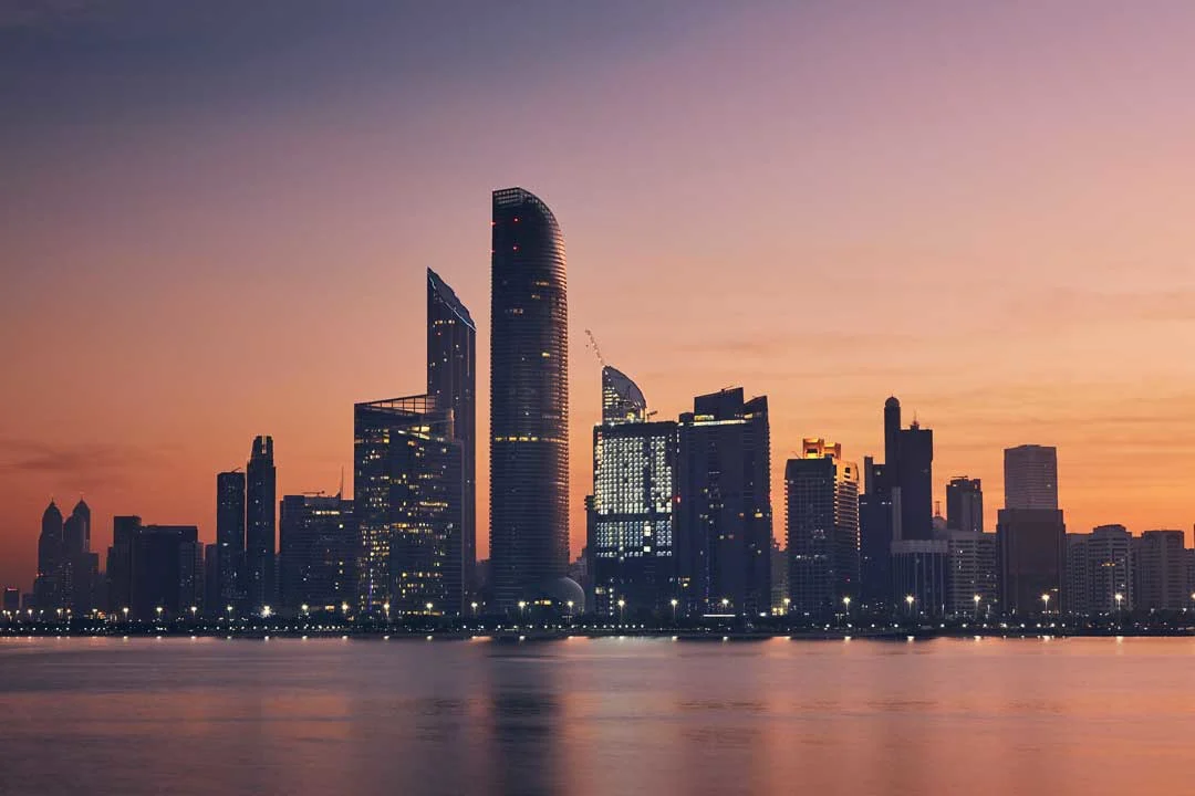 Abu Dhabi city skyline with tall buildings and waterfront view Abu Dhabi travel tips