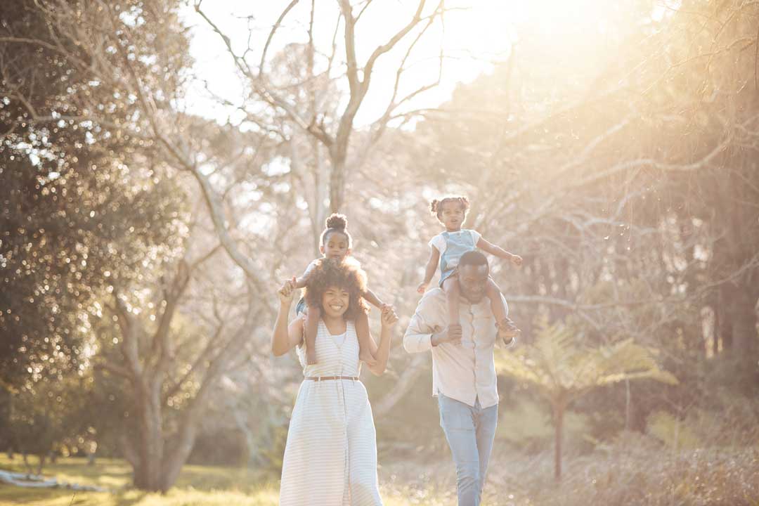 Outdoor family photography session with warm natural light