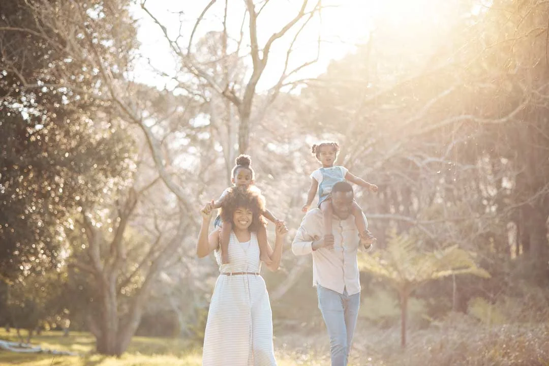Outdoor family photography session with warm natural light