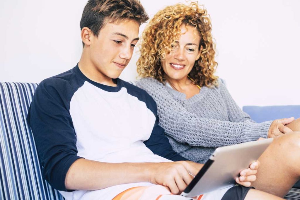 Parent and teenager setting screen time rules