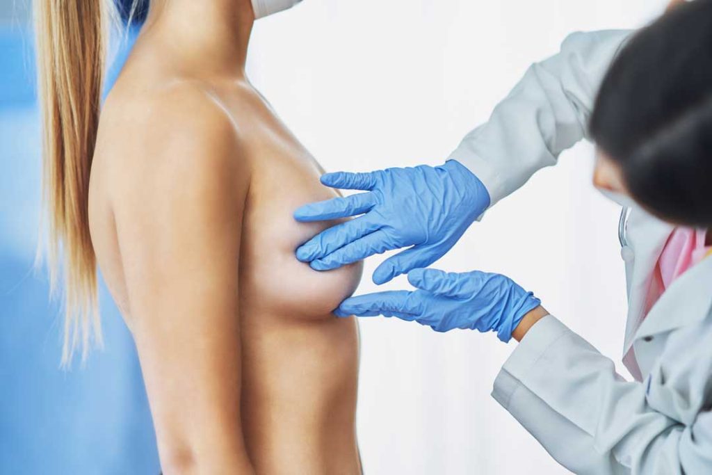 Patient discussing breast lift options with surgeon