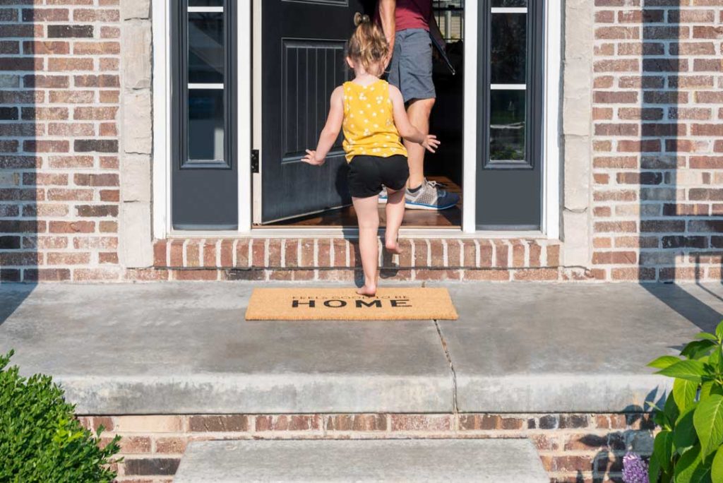 Personalized home decor including a doormat with family name