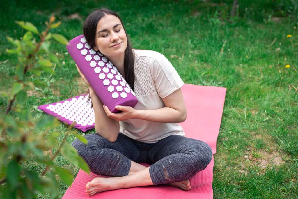 Relaxing on an acupressure mat for stress relief