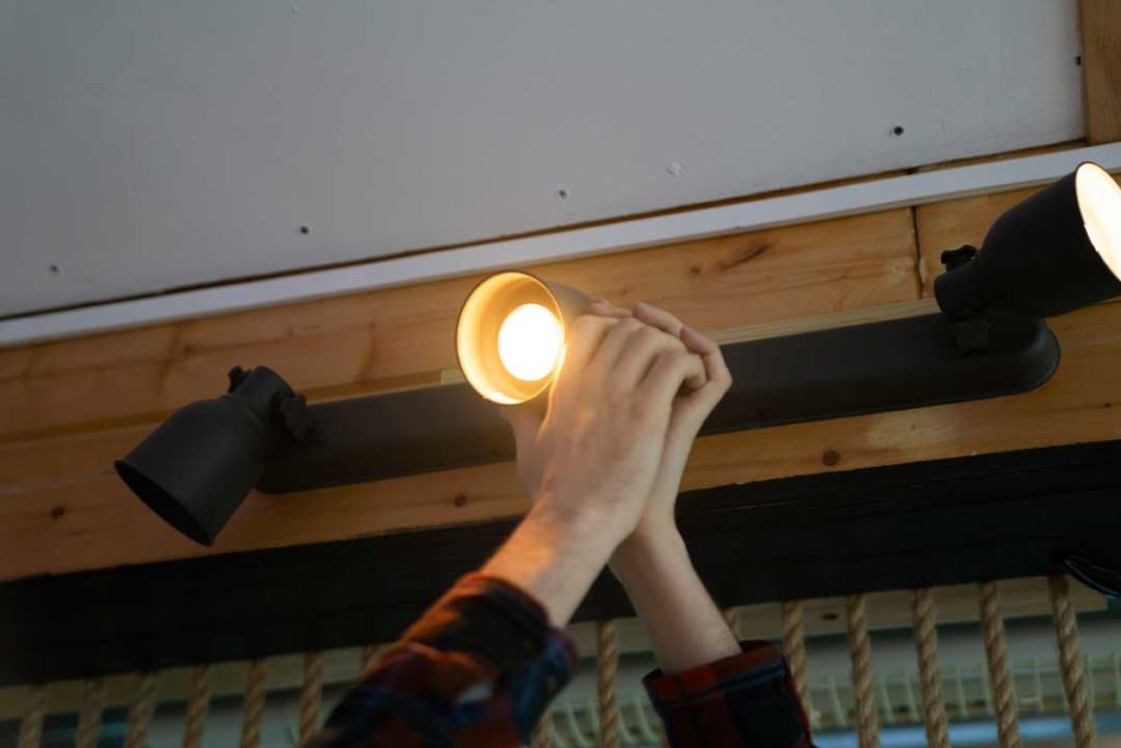 Replacing outdoor landscape light bulb for better performance