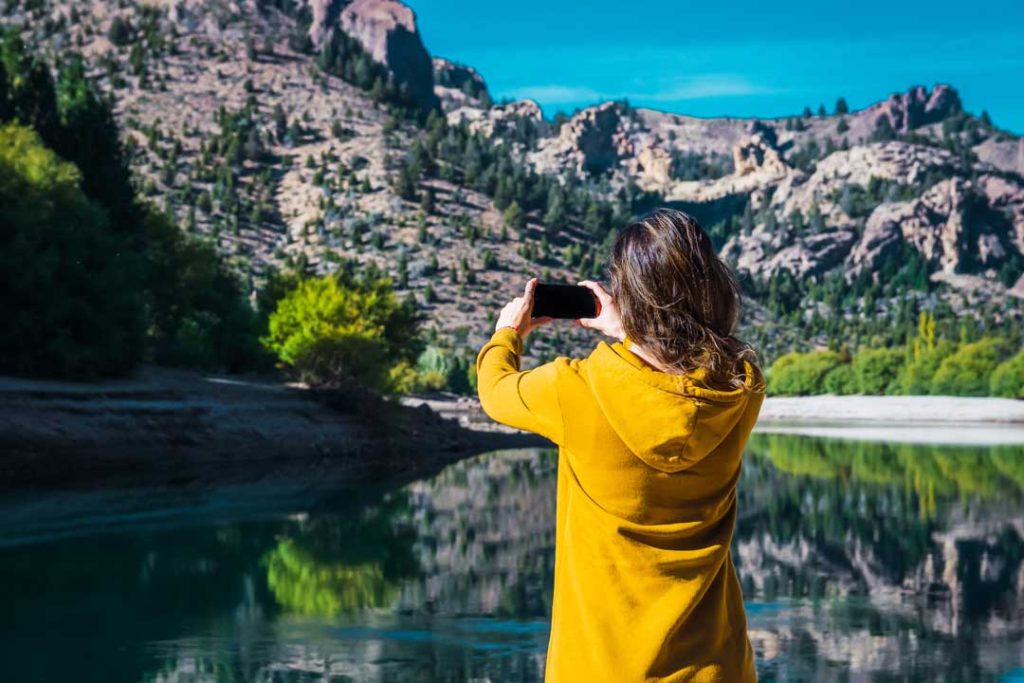 Female tourist capturing local scenery