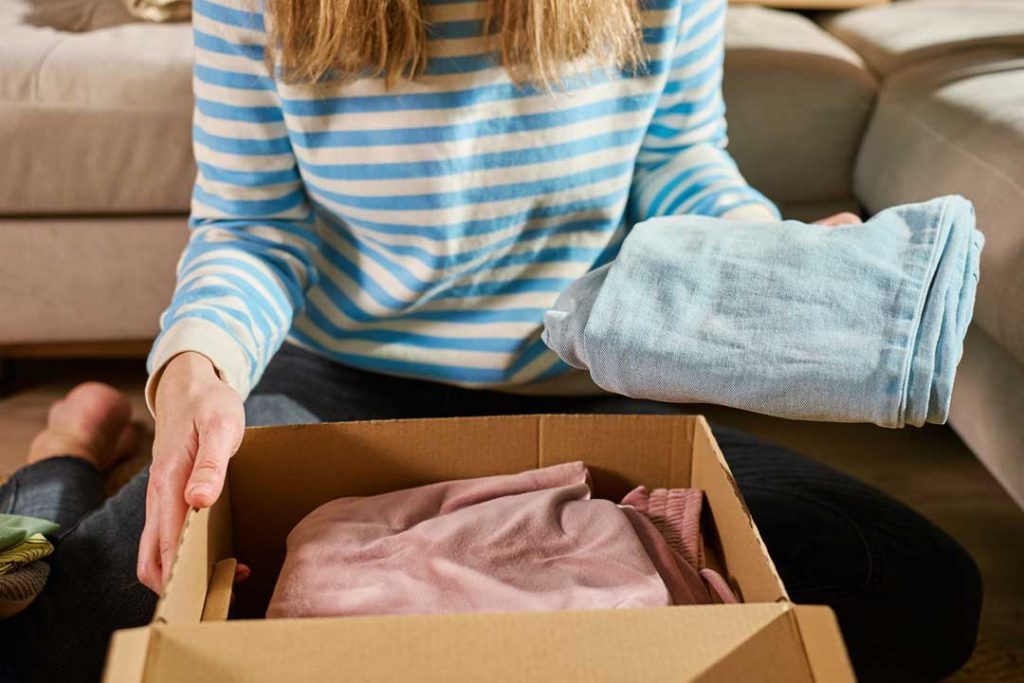 Woman sorting items in a box