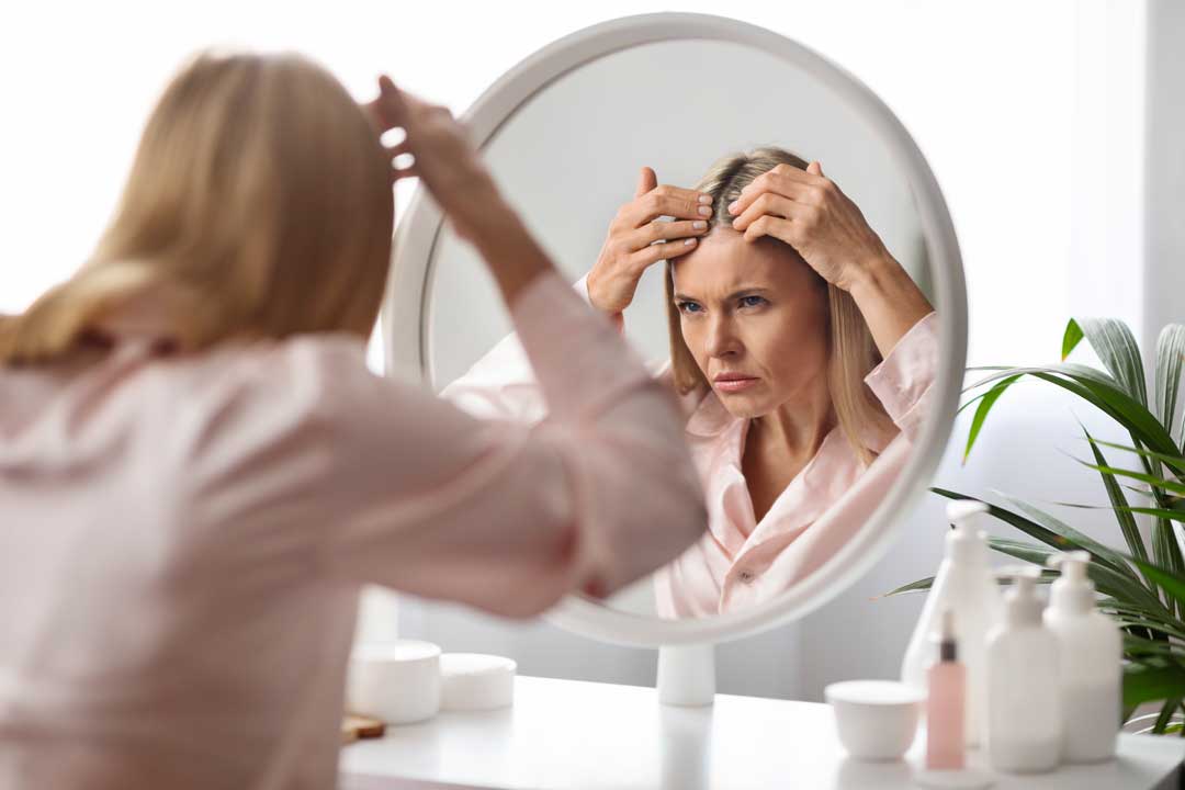 Person checking for scalp infection and hair loss scalp infections and hair loss