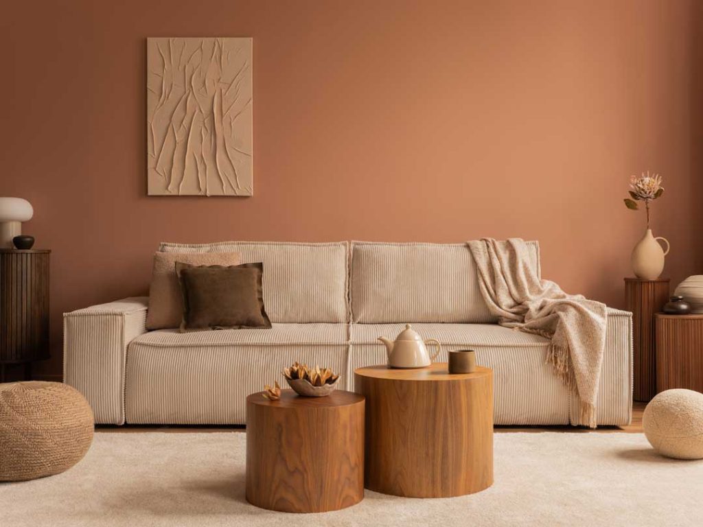 Cozy living room with plush furniture, warm lighting, and layered rugs