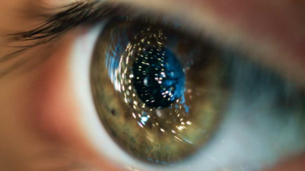 Eye close-up showing light reflections