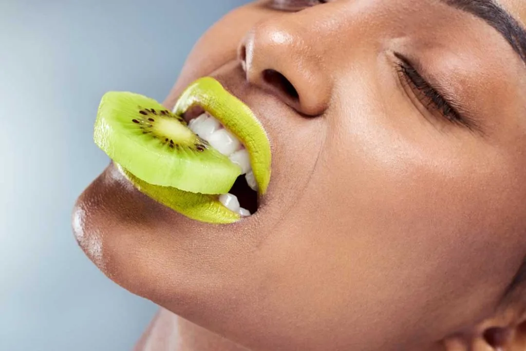 A close-up of healthy teeth thoroughly chewing food, emphasizing the role of chewing in stimulating saliva and maintaining oral hygiene