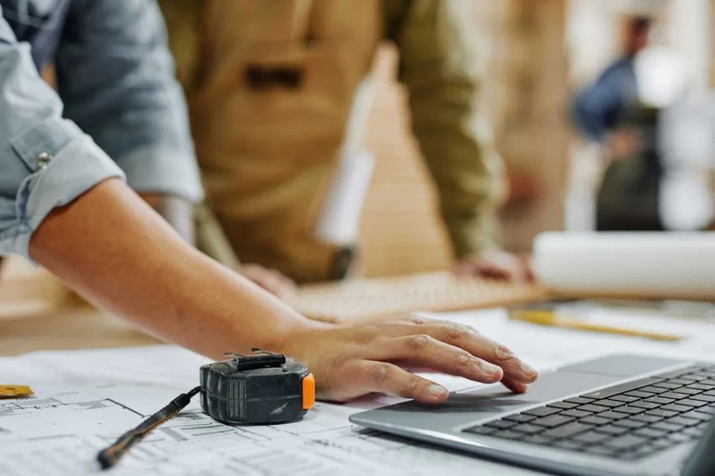 Image of a contractor inputting data into a CRM