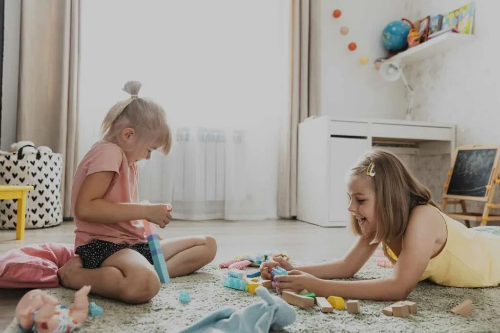 Kids playing at home with toys
