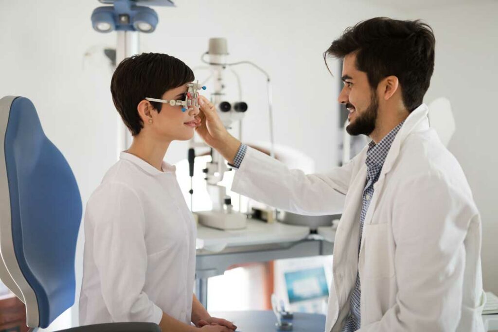 Optometrist and patient in clinic