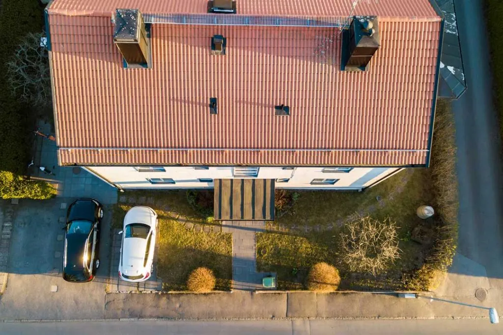 Overhead drone shot of a house roof with measurement markers