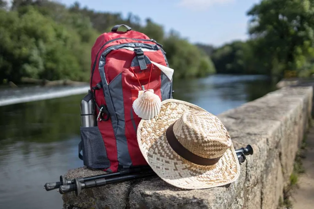 An organized fishing bag with visible snacks, water bottles, and other necessary items for a comfortable family fishing trip.