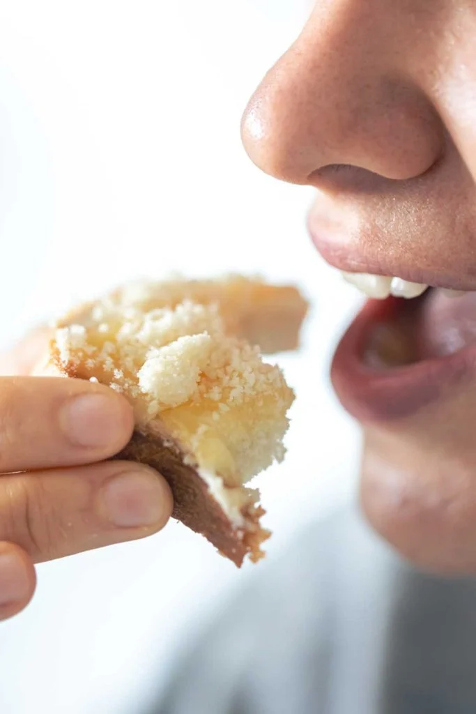 A visual representation of saliva interacting with food in the mouth, emphasizing the initial breakdown of carbohydrates during thorough chewing.