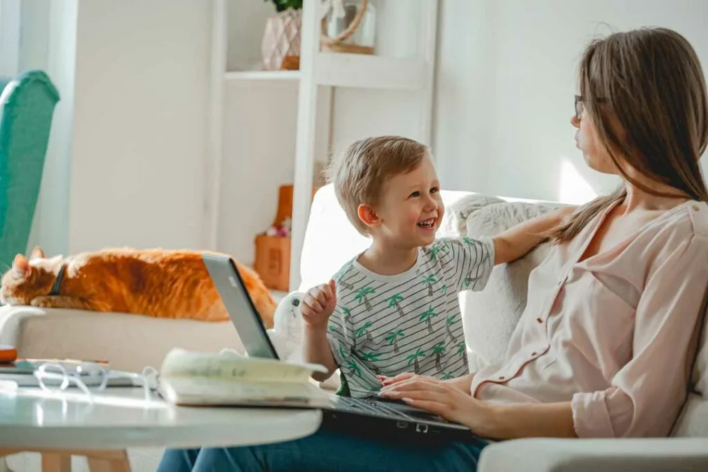 Mom freelancing from home with coffee and laptop