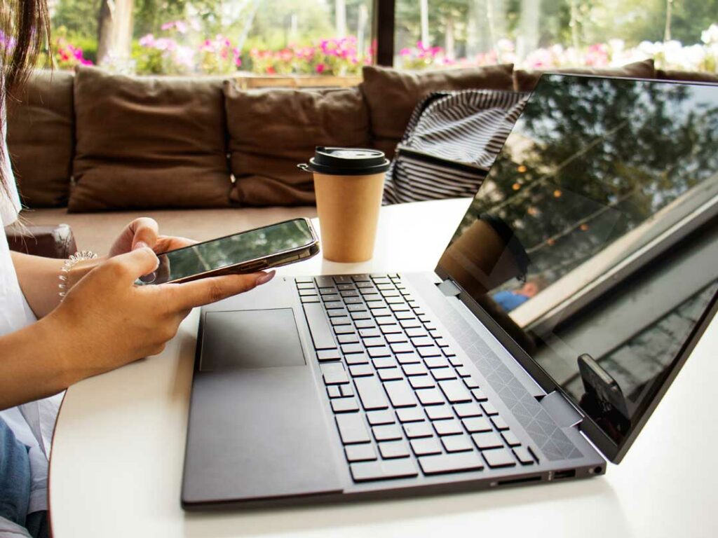  laptop, notebook, coffee, and phone