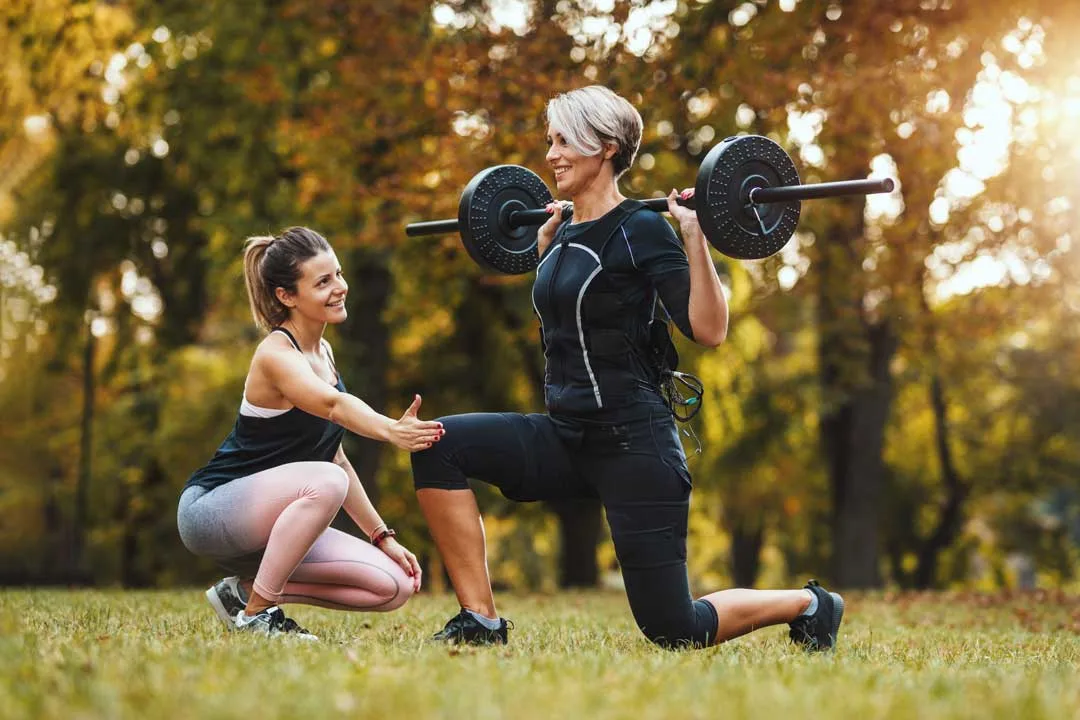 mum exercising with a personal trainer