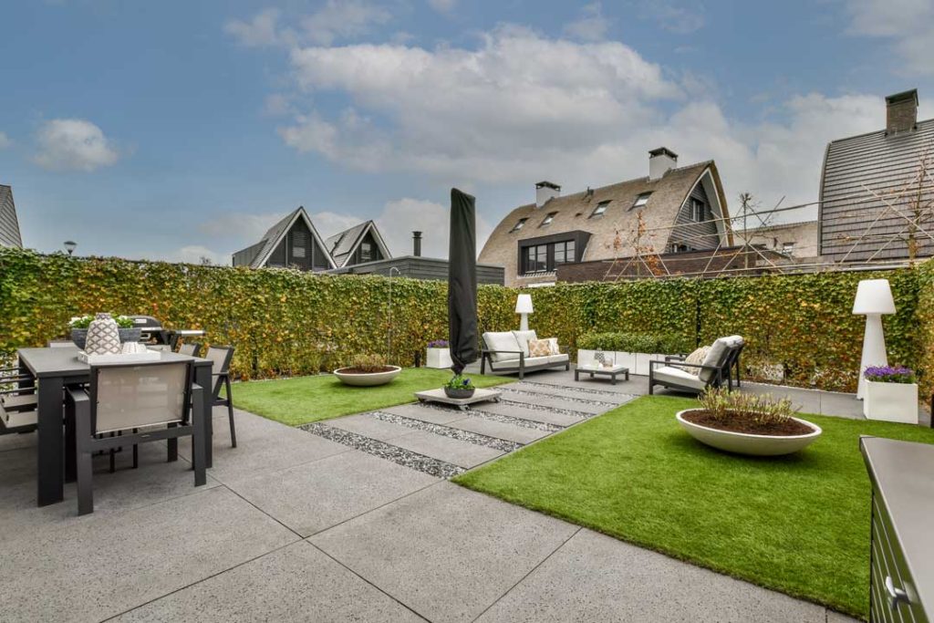 Low-maintenance outdoor space with artificial turf