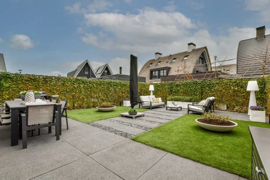 Low-maintenance outdoor space with artificial turf