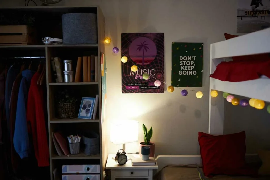 Personalized student dorm with photos, string lights, and wall art