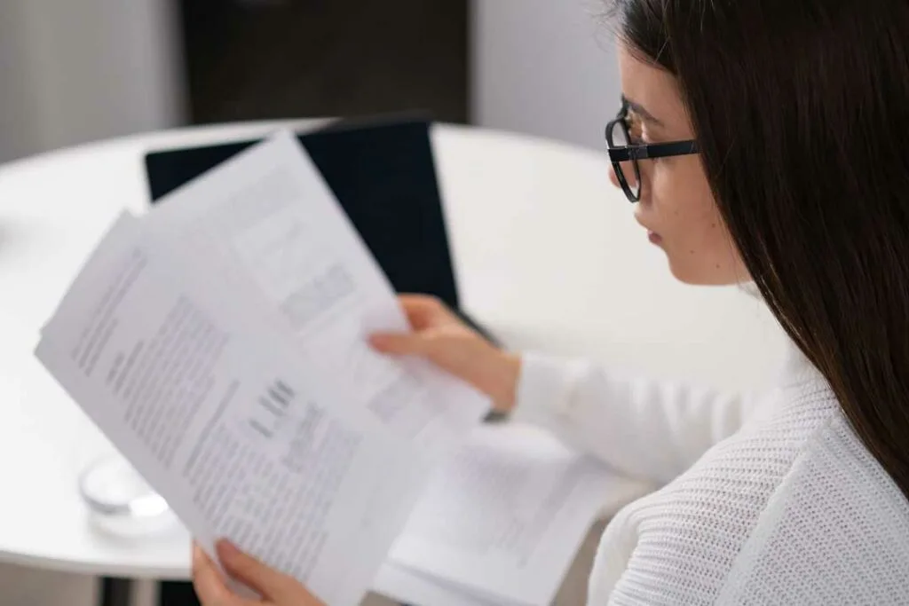 Business professional reviewing warranty documents