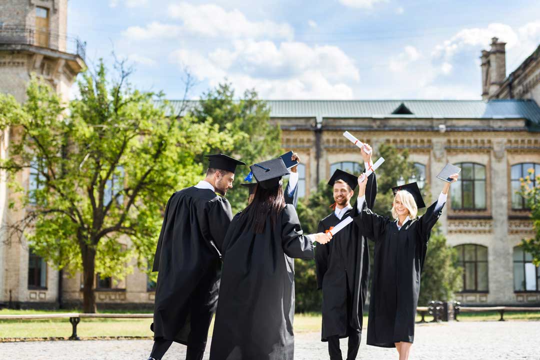 College graduates celebrating the benefits of higher education