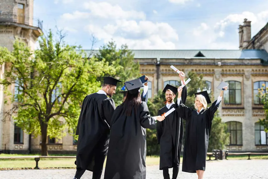 College graduates celebrating the benefits of higher education