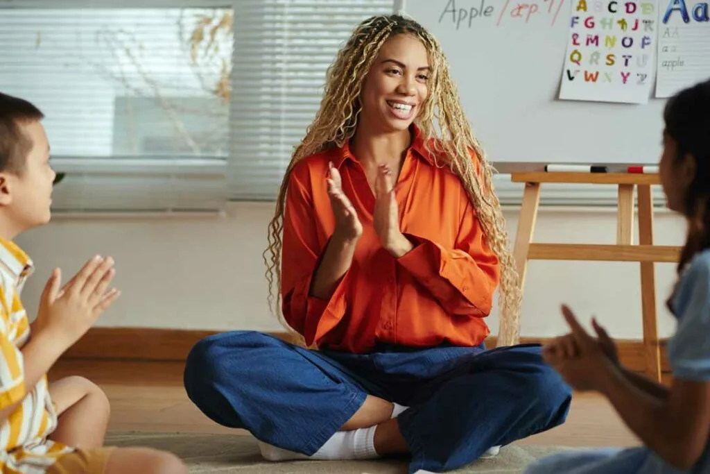 Teacher guiding students through social emotional learning practice
