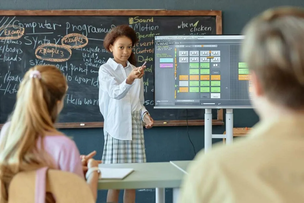 Teacher integrating technology in classroom with interactive learning tools