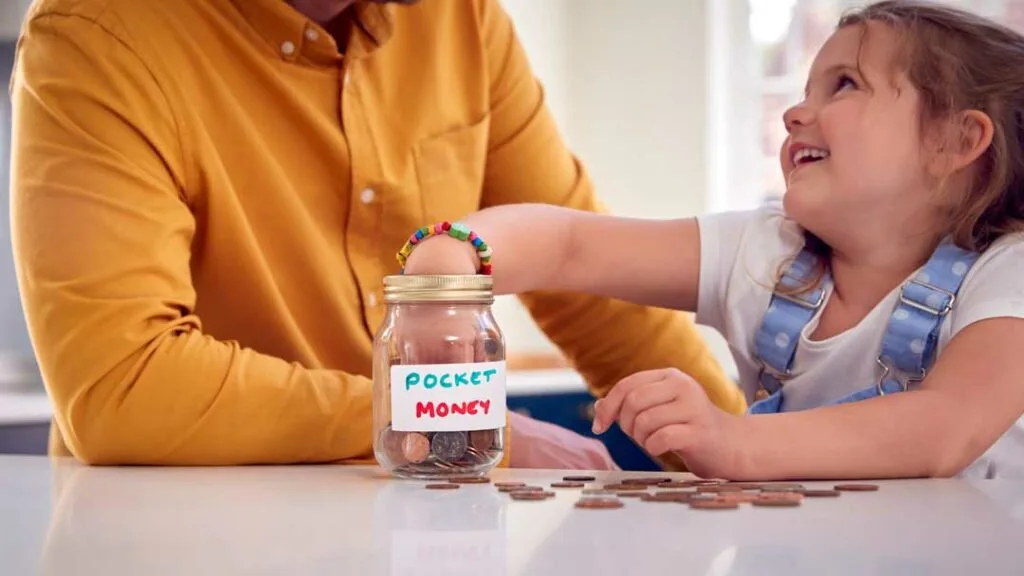 Visual money jars teaching preschoolers to save, spend, and share