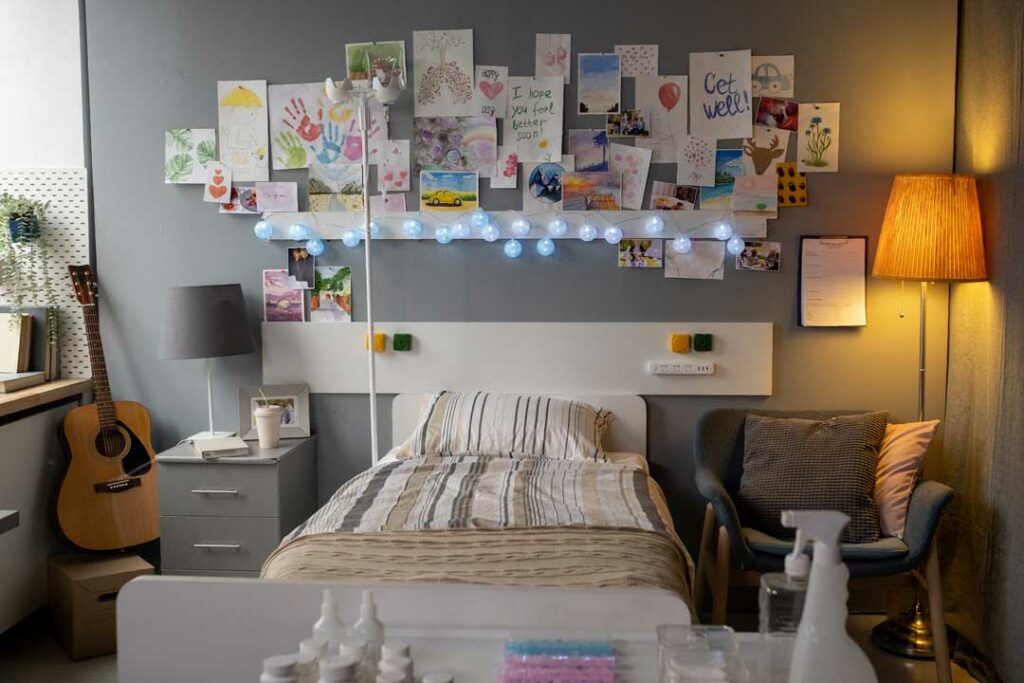 Memory wall in student housing decorated with photos and personal memorabilia